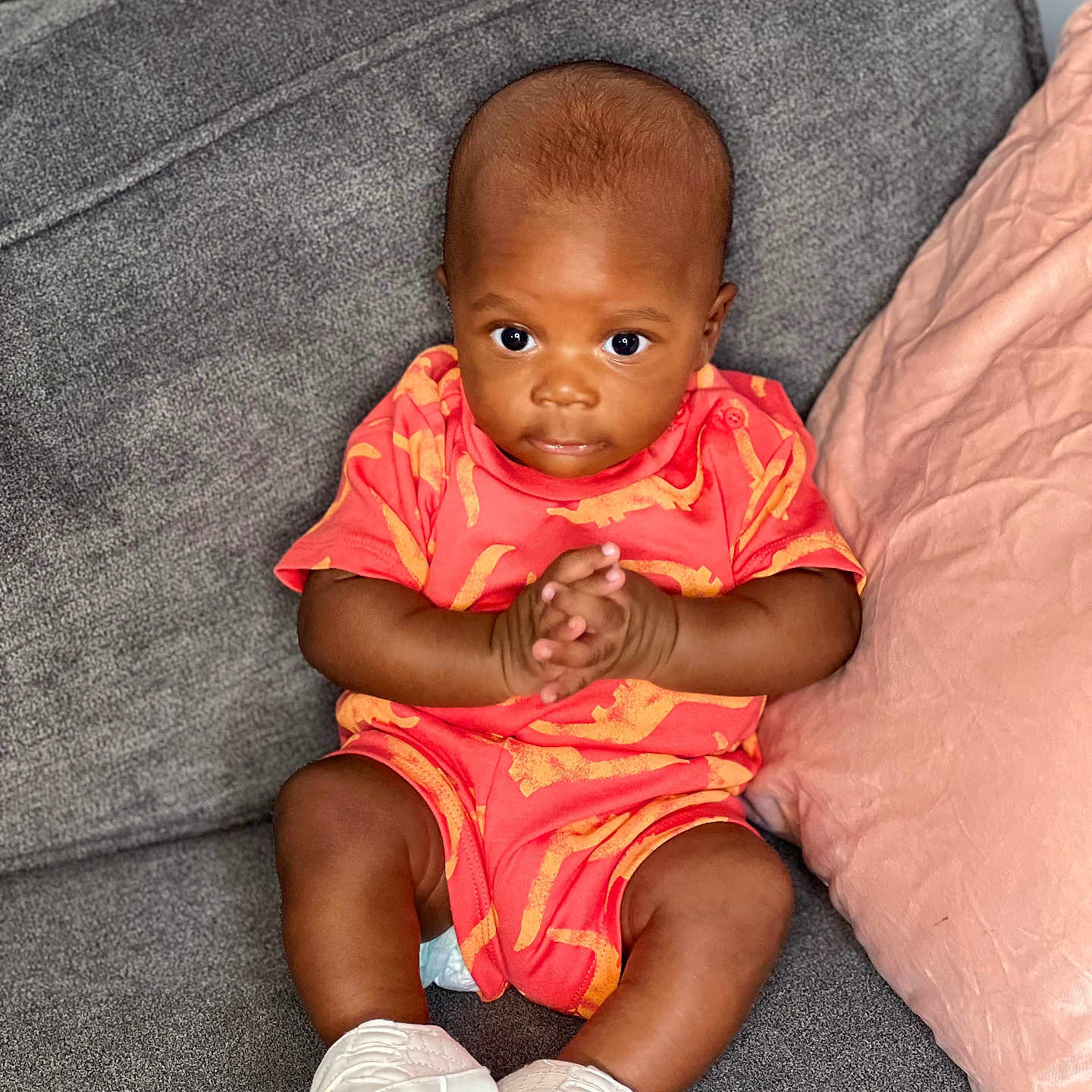 Eliot Dika Uwagwu is registered to the contest to win money with this photo: baby, bodypart, clothing, couch, cushion, face, finger, footwear, furniture, head, homedecor, pants, person, photography, portrait, shoe, shorts, sitting, sleeve, sneaker