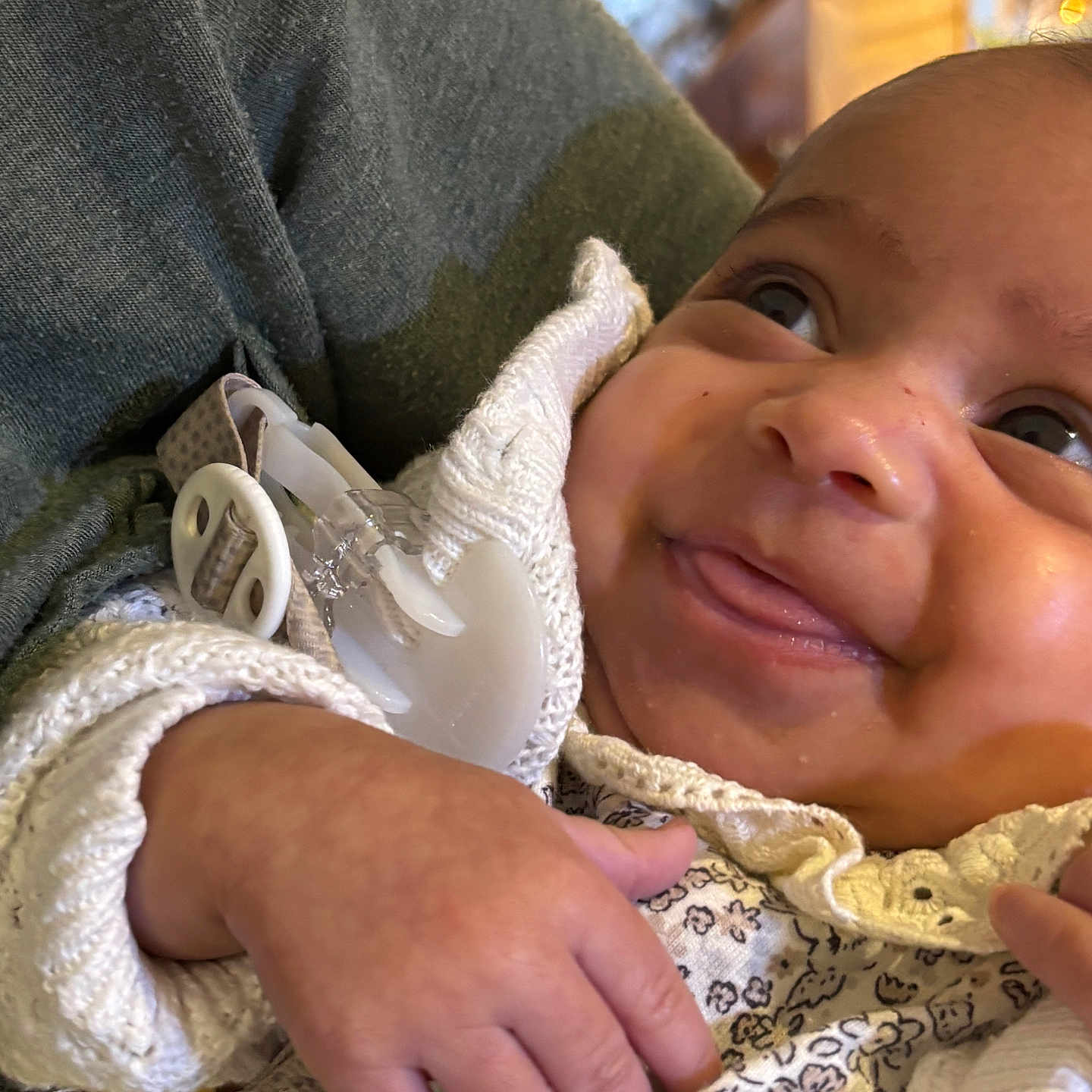 Bobby-Sage joined the competition — help win amazing prizes! baby, child, close_up, clothing, cozy, cute, face, floral_pattern, hand, happy, holding, indoor, infant, joyful, knitted_sweater, pacifier, person, smiling, soft_texture, warm_lighting