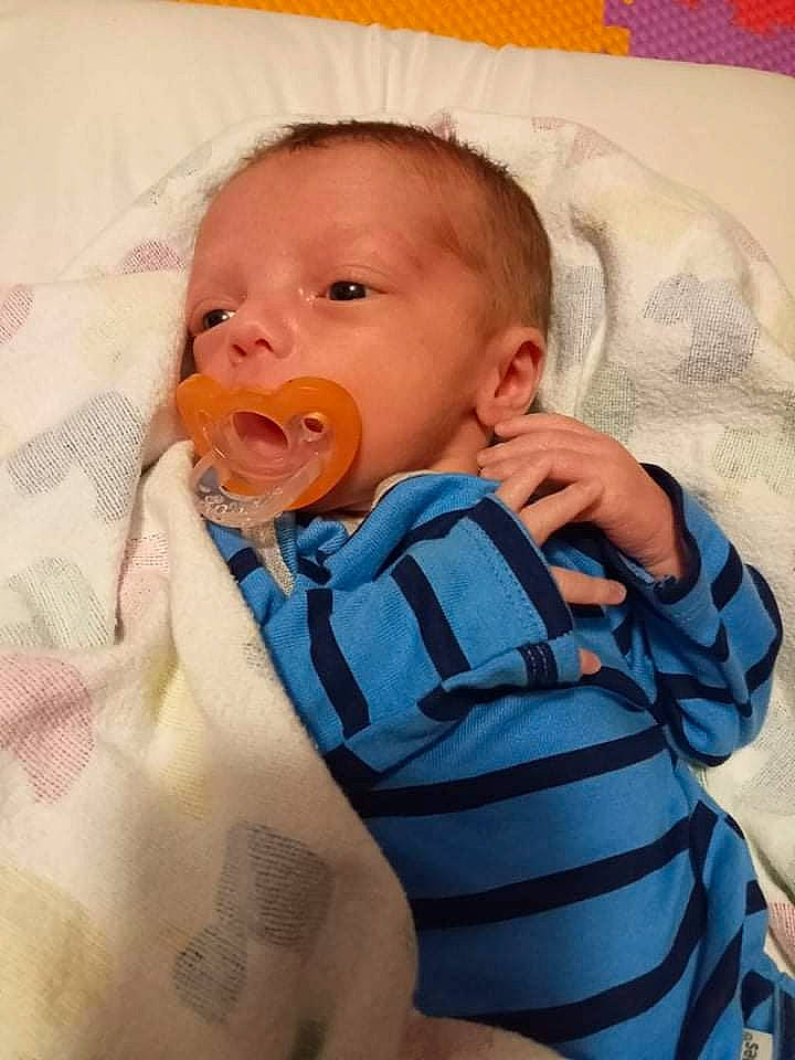 Aidan is registered to the contest to win money with this photo: baby, baby_sleeping, baby_toddler_clothing, cheek, child, comfort, eyebrow, face, finger, head, infant_bed, iris, linens, mouth, nose, person, skin, sleeve, textile, thumb