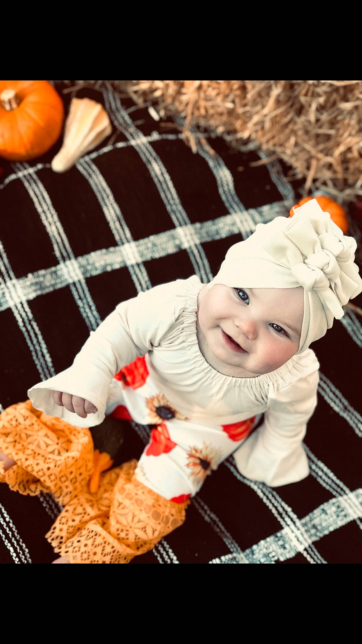 Camilla is registered to the contest to win money with this photo: baby, baby_toddler_clothing, child, event, flash_photography, fun, grass, happy, headwear, joy, pattern, person, plaid, portrait_photography, sitting, sleeve, smile, sock, tartan, textile