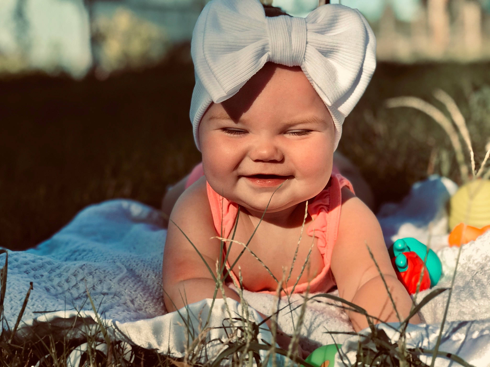 Camilla is registered to the contest to win money with this photo: baby, baseball_cap, cap, child, event, eye, fashion_accessory, flash_photography, fun, grass, happy, hat, headgear, headwear, iris, jewellery, joy, leisure, people_in_nature, person