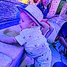 children, baby, toddler, girl, boy, hat, crawling, outdoor, patio, water_feature, stone_wall, blue_lighting, colorful_lighting, portrait, siblings, summer, clothing, shoes, playful, family
