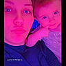 Luna joined the competition — help win amazing prizes! woman, baby, selfie, portrait, face, child, indoor, closeup, expression, colorful_lighting, pink, purple, casual_clothing, human, two_people, baby_gesture, fun, playful, digital_photo, timestamp