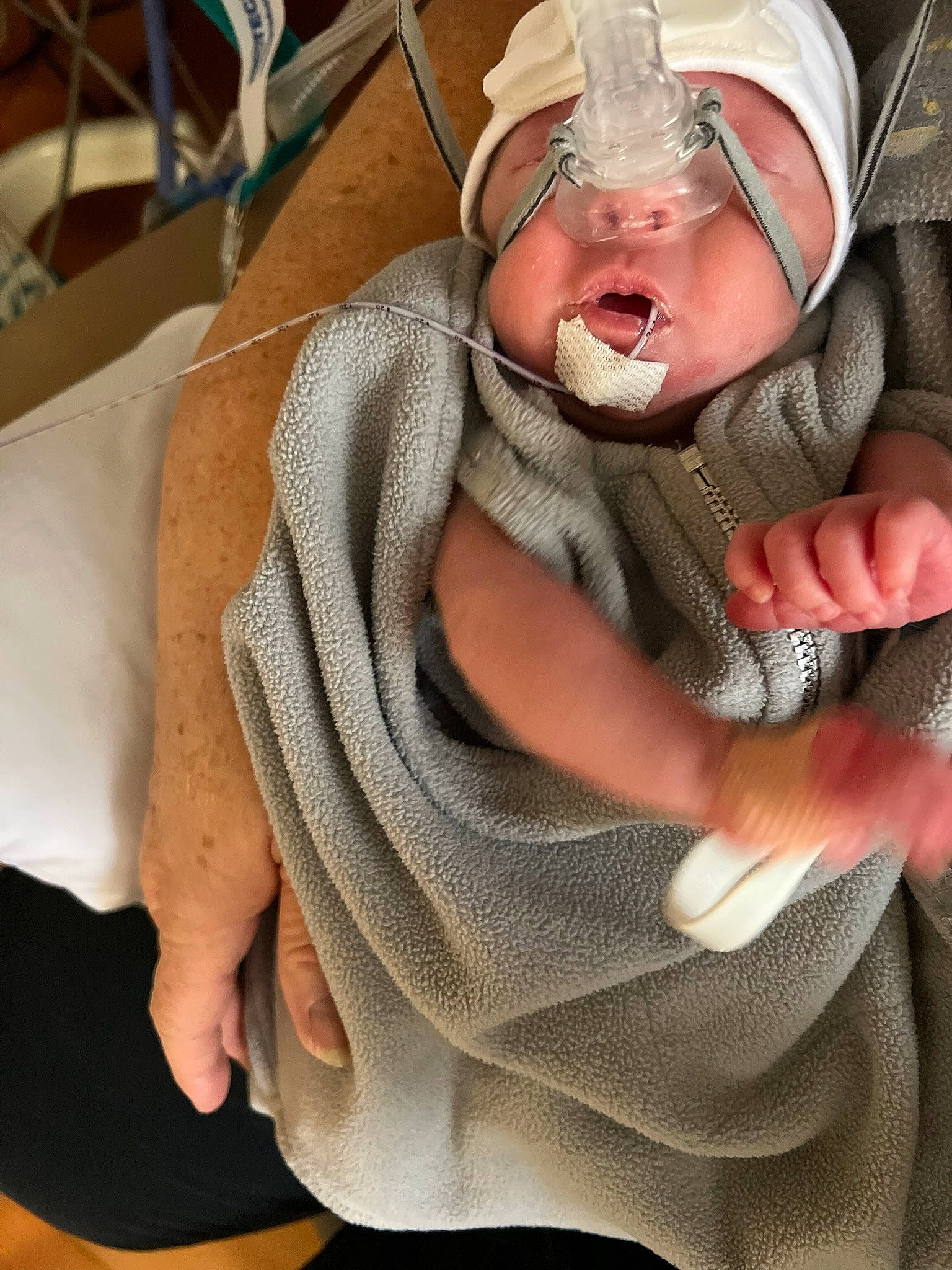 Hailey is registered to the contest to win money with this photo: baby, baby_products, baby_safety, baby_sleeping, baby_toddler_clothing, child, comfort, finger, gesture, happy, linens, mouth, neck, person, scarf, sitting, skin, sleeve, thumb, toddler