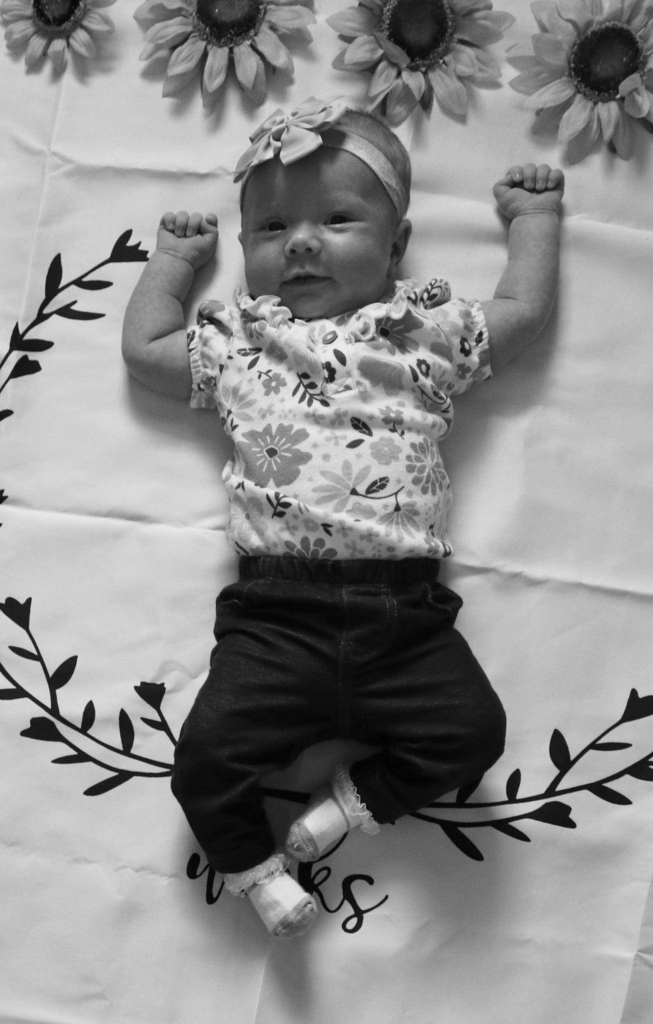 Aiyla is registered to the contest to win money with this photo: baby, black, black_and_white, branch, child, leaf, monochrome, monochrome_photography, person, photograph, photography, plant, smile, stock_photography, style, toddler, tree, white