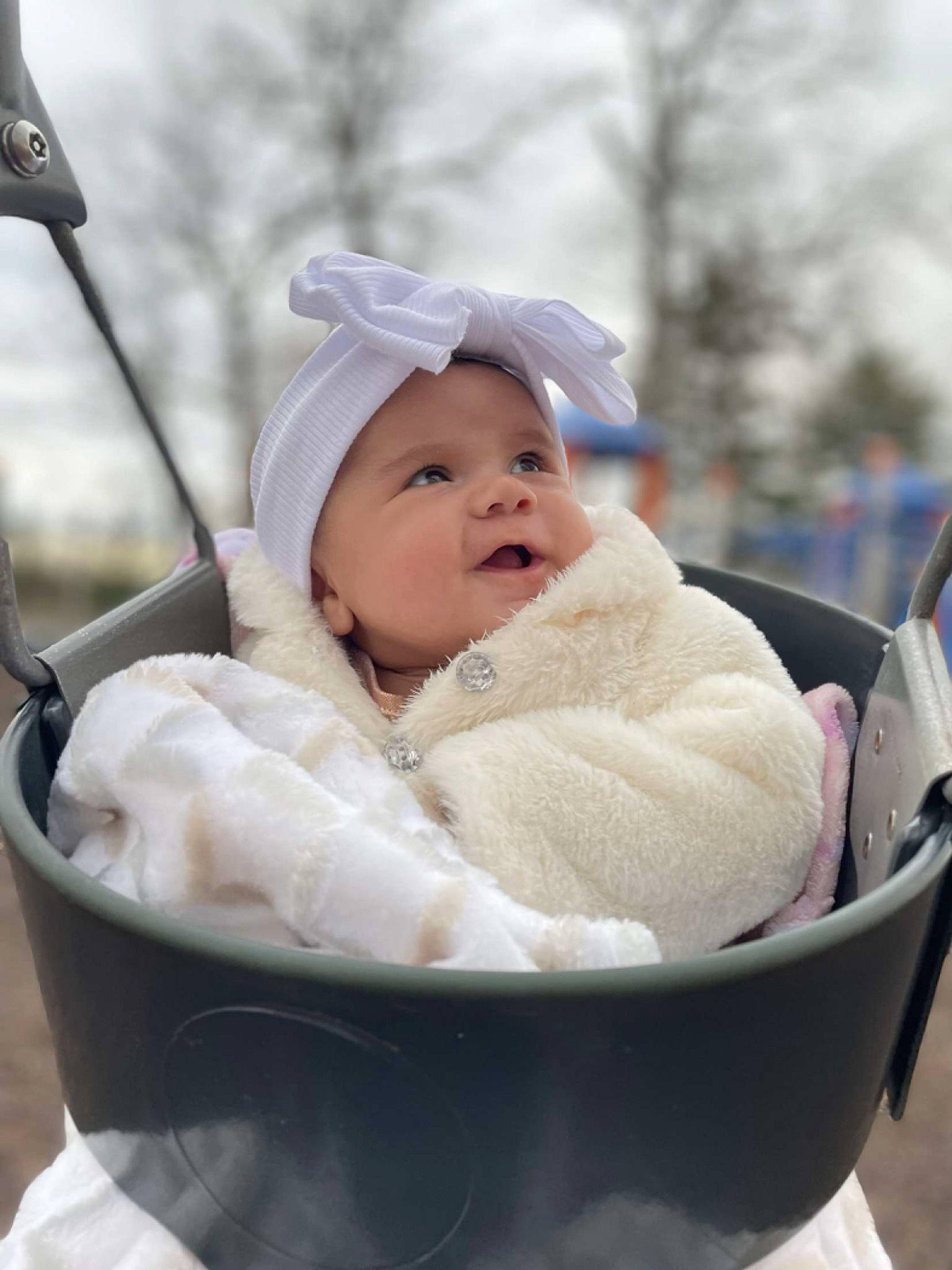 Miley joined the competition — help win amazing prizes! baby, baby_carriage, baby_products, baby_toddler_clothing, cheek, child, comfort, event, face, fun, grass, happy, hat, headwear, leisure, person, portrait_photography, recreation, sitting, sky