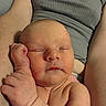 Summer is registered to the contest to win money with this photo: baby, sleeping, arms, skin, person, child, hand, face, closeup, resting, peaceful, infant, newborn, human, portrait, relaxing, comfort, cuddle, tank_top, skin_texture