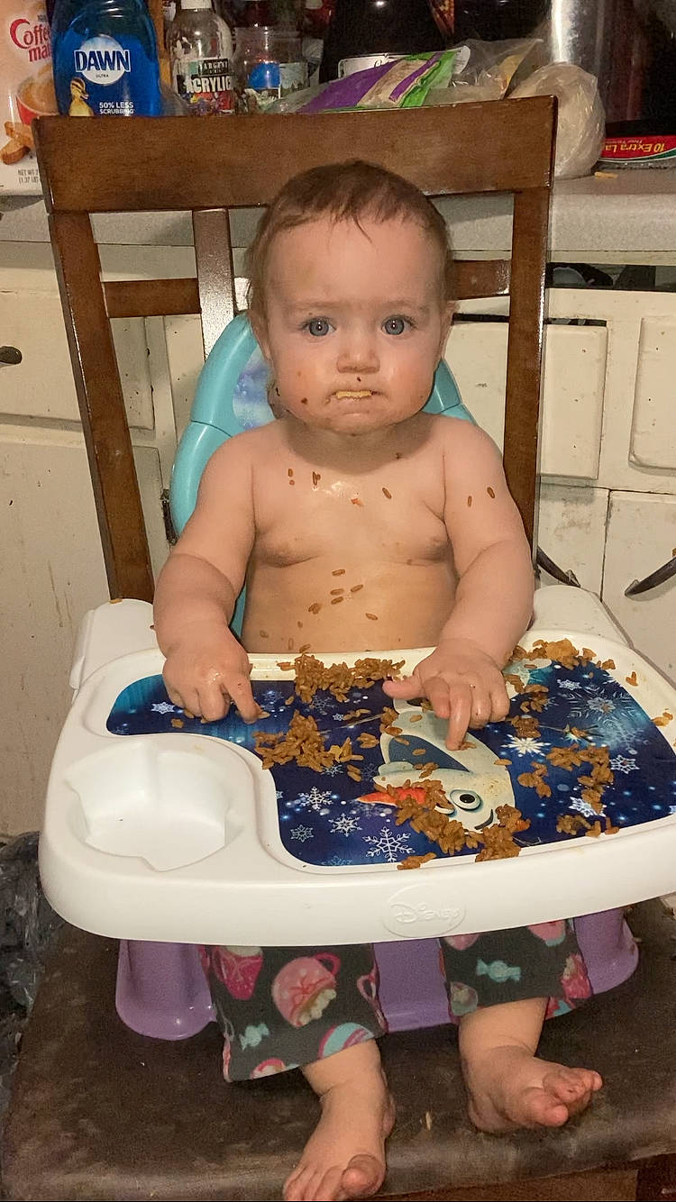 Ellianna is registered to the contest to win money with this photo: abdomen, baby, baby_food, baby_products, baby_toddler_clothing, bathing, chair, cheek, chest, child, diaper, event, flooring, fun, iris, leisure, person, plastic_bottle, sitting, thigh