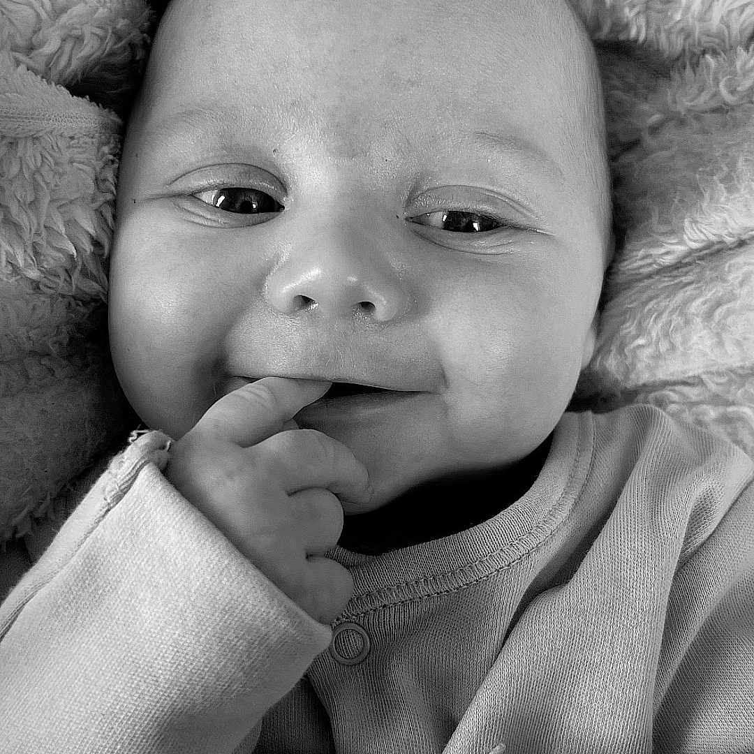 Theo joined the competition — help win amazing prizes! baby, blanket, bodypart, clothing, face, finger, hand, happy, head, homedecor, knitwear, laughing, mouth, newborn, person, photography, portrait, quilt, smile, sweater