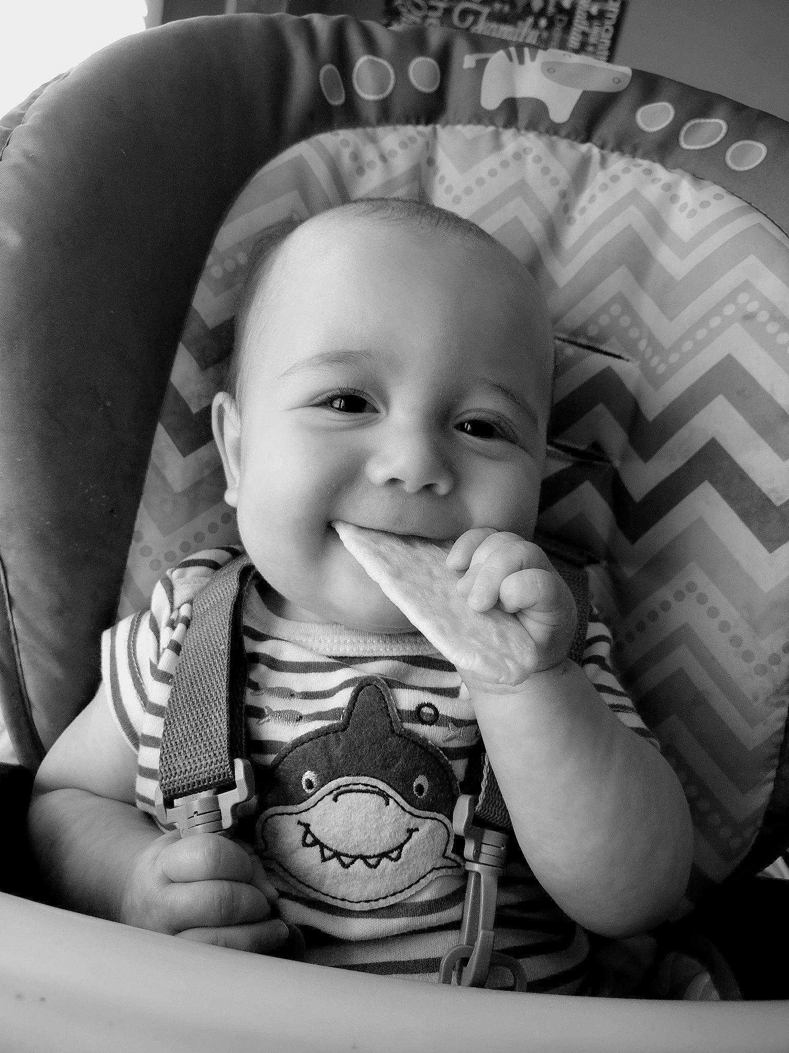 Preston is registered to the contest to win money with this photo: arm, black, cheek, comfort, eyebrow, facial_expression, hand, happy, human, iris, lip, mouth, nose, organ, person, photograph, product, skin, sleeve, smile