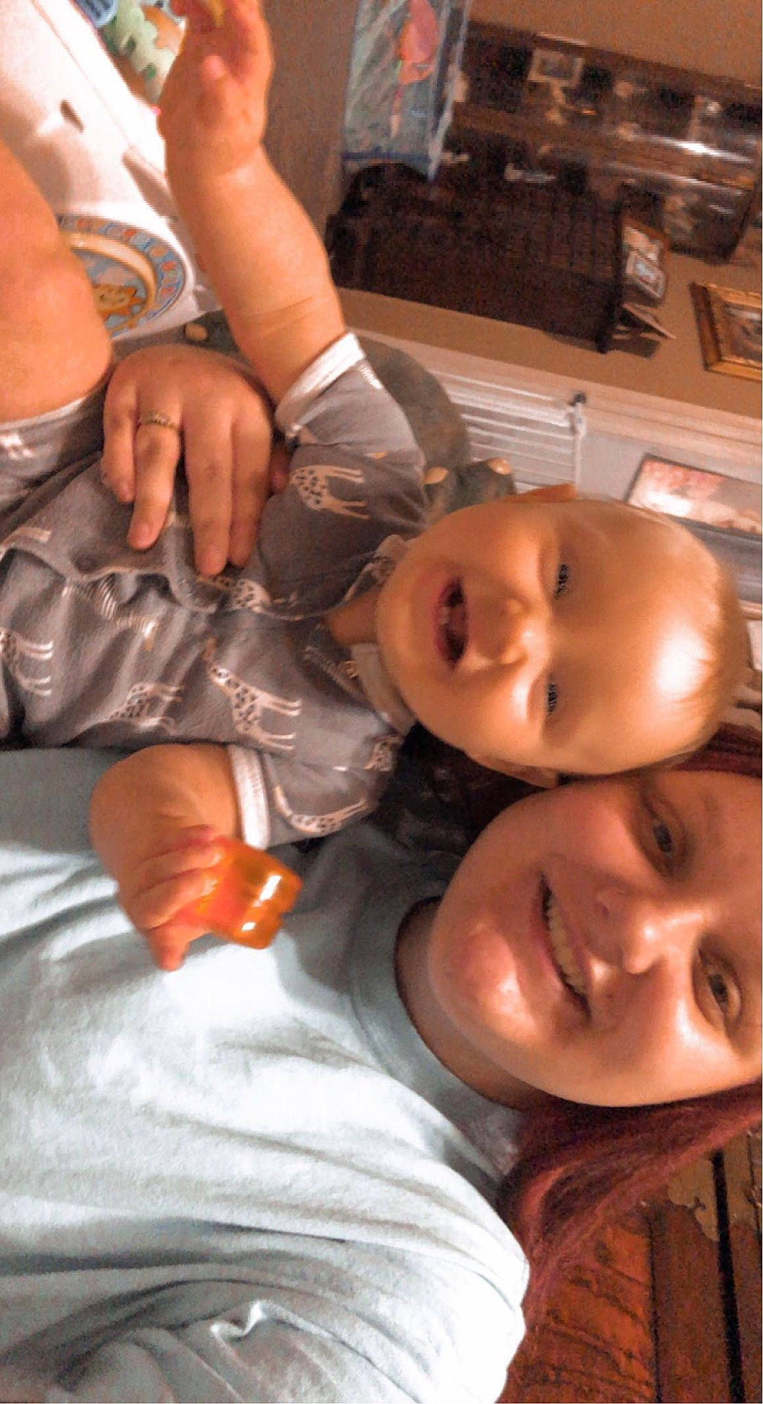 Kinsleigh is registered to the contest to win money with this photo: cheek, ear, eye, eyelash, facial_expression, finger, fun, gesture, hand, happy, headwear, human_body, joy, lip, mouth, muscle, nose, orange, person, skin