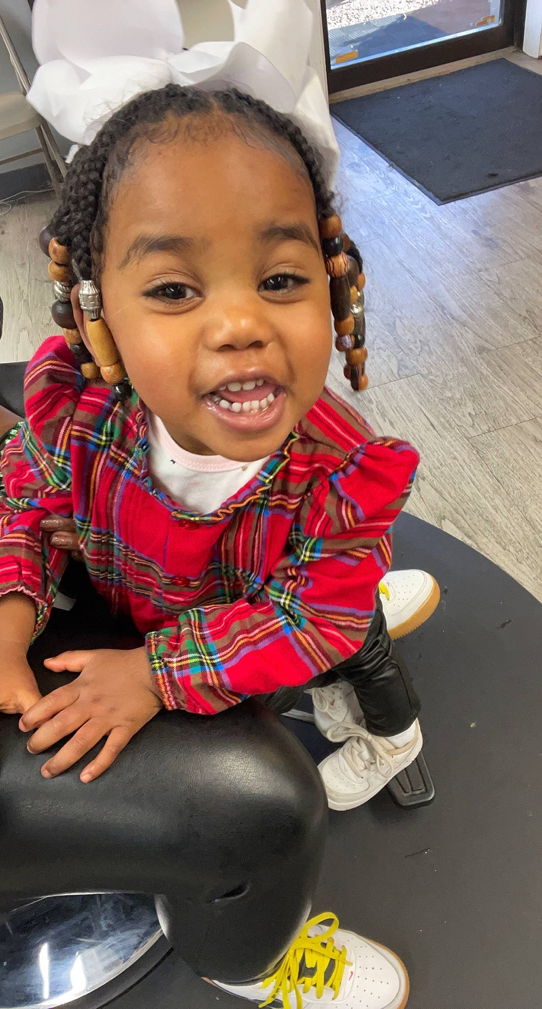 Ma Ryleigh joined the competition — help win amazing prizes! baby_toddler_clothing, black_hair, cheek, child, chin, cool, eye, face, facial_expression, fun, hair, happy, head, lip, person, plaid, skin, smile, sock, tartan