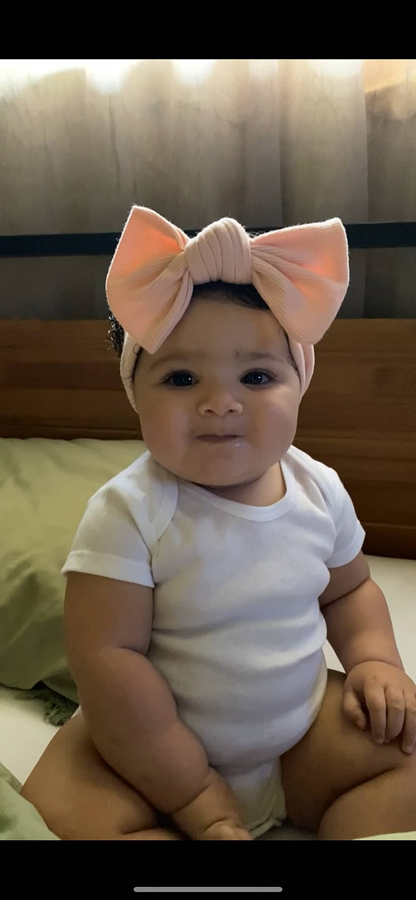 Lux is registered to the contest to win money with this photo: baby, baby_toddler_clothing, bonnet, cap, cheek, child, comfort, costume_accessory, costume_hat, eyelash, face, fashion_accessory, hair_accessory, happy, head, headband, headwear, person, skin, sleeve