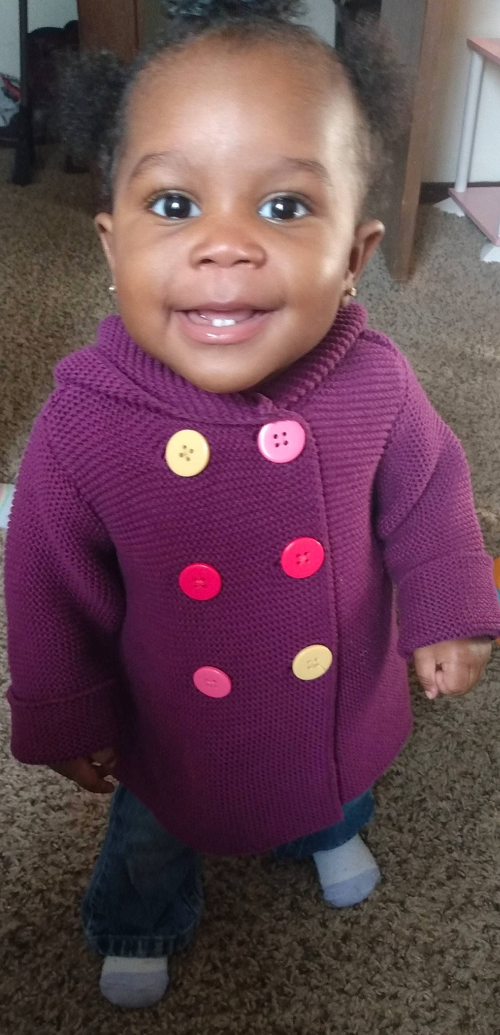 Journey is registered to the contest to win money with this photo: baby, baby_toddler_clothing, cheek, child, design, face, head, lip, magenta, outerwear, pattern, person, pink, purple, skin, sleeve, smile, sweater, toddler, wool
