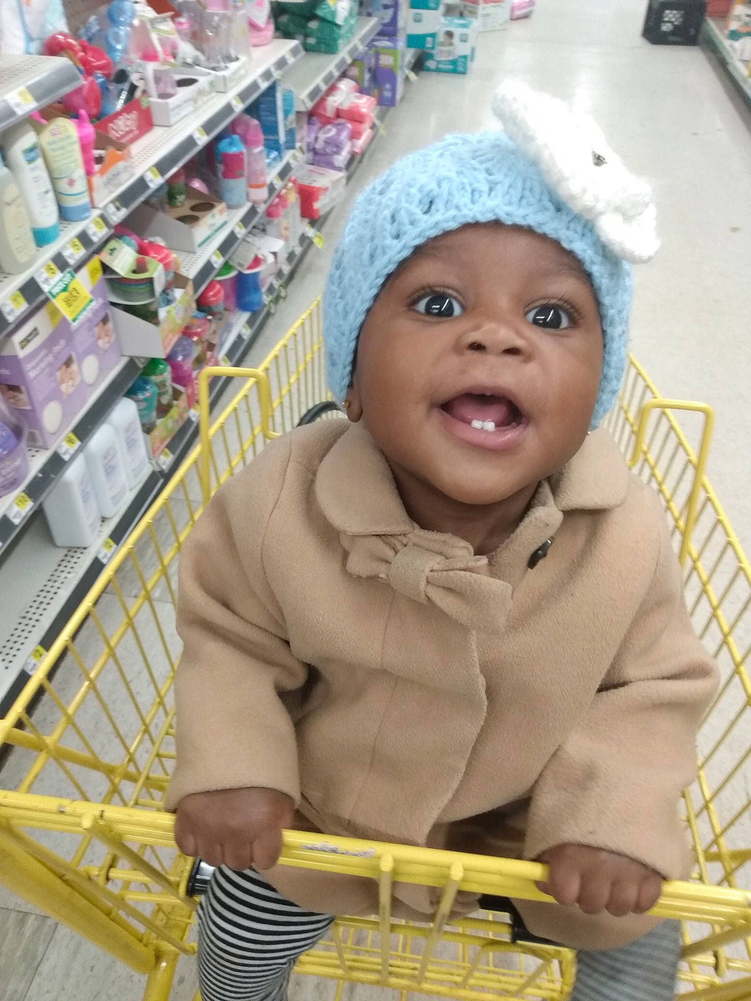 Journey is registered to the contest to win money with this photo: baby, cart, child, person, shopping_cart, smile, supermarket, toddler, vehicle