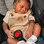 Phoenix joined the competition — help win amazing prizes! baby, infant, car_seat, graco, sleeping, smiling, clothing, overalls, elephant_pattern, white_socks, child, cute, comfort, seatbelt, black_hair, skin, small_hands, footwear, closeup, indoor