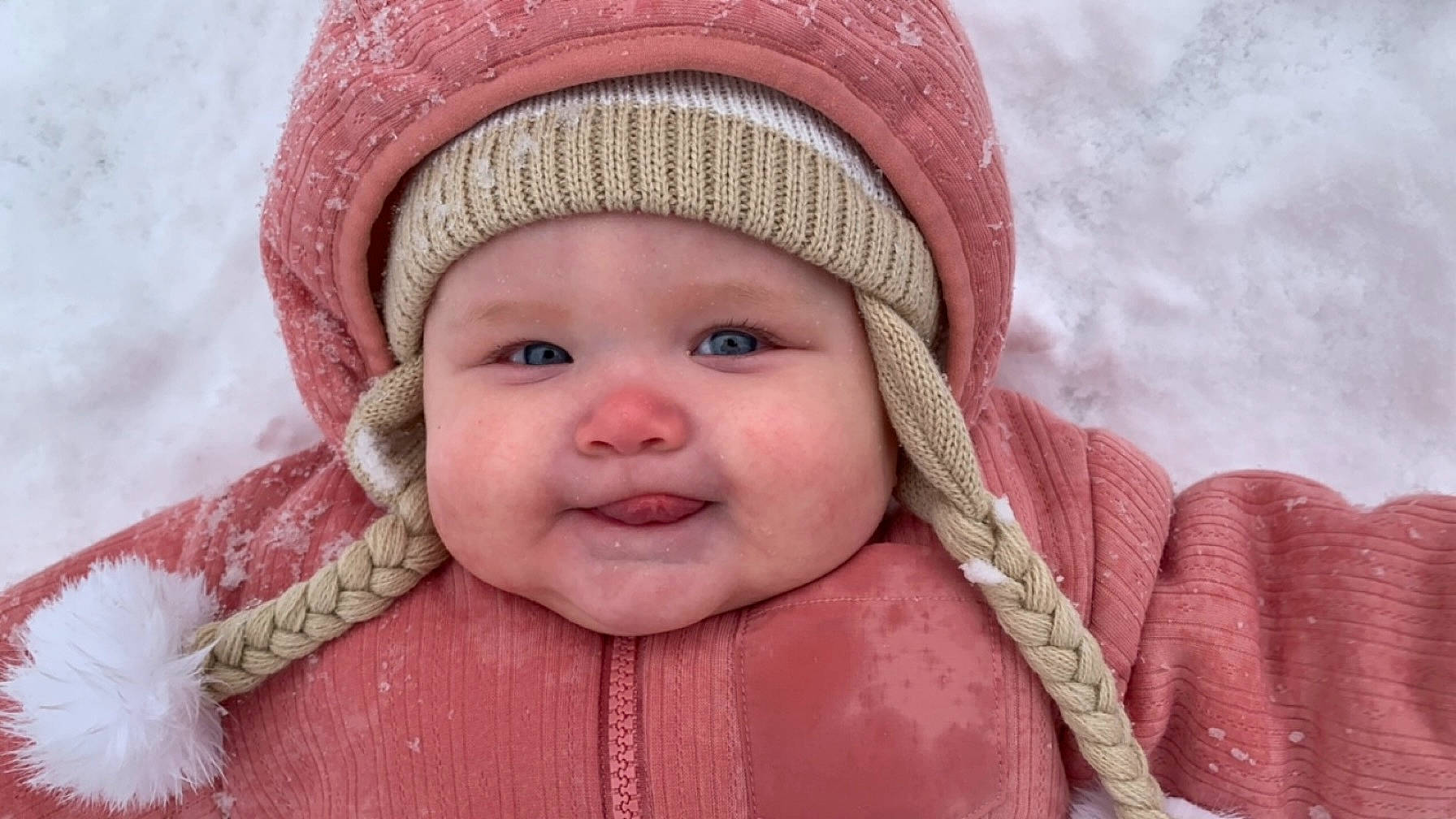 Allie is registered to the contest to win money with this photo: baby, cap, cheek, child, close_up, eye, face, happy, headgear, headwear, jacket, joy, knit_cap, lip, nose, organ, outerwear, person, pink, red