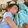 Eden participe au concours pour gagner de l'argent avec cette photo : baby, sleeping, blanket, pacifier, hand, infant, soft, cozy, child, rest, comfort, holding, blue, patterned, clothing, person, cute, peaceful, nap, toddler