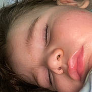 Eden participe au concours pour gagner de l'argent avec cette photo : child, sleeping, face, close_up, rosy_cheeks, hair, pillow, resting, peaceful, innocence, skin, eyelashes, nose, lips, indoors, quiet, soft_light, portrait, young, relaxation