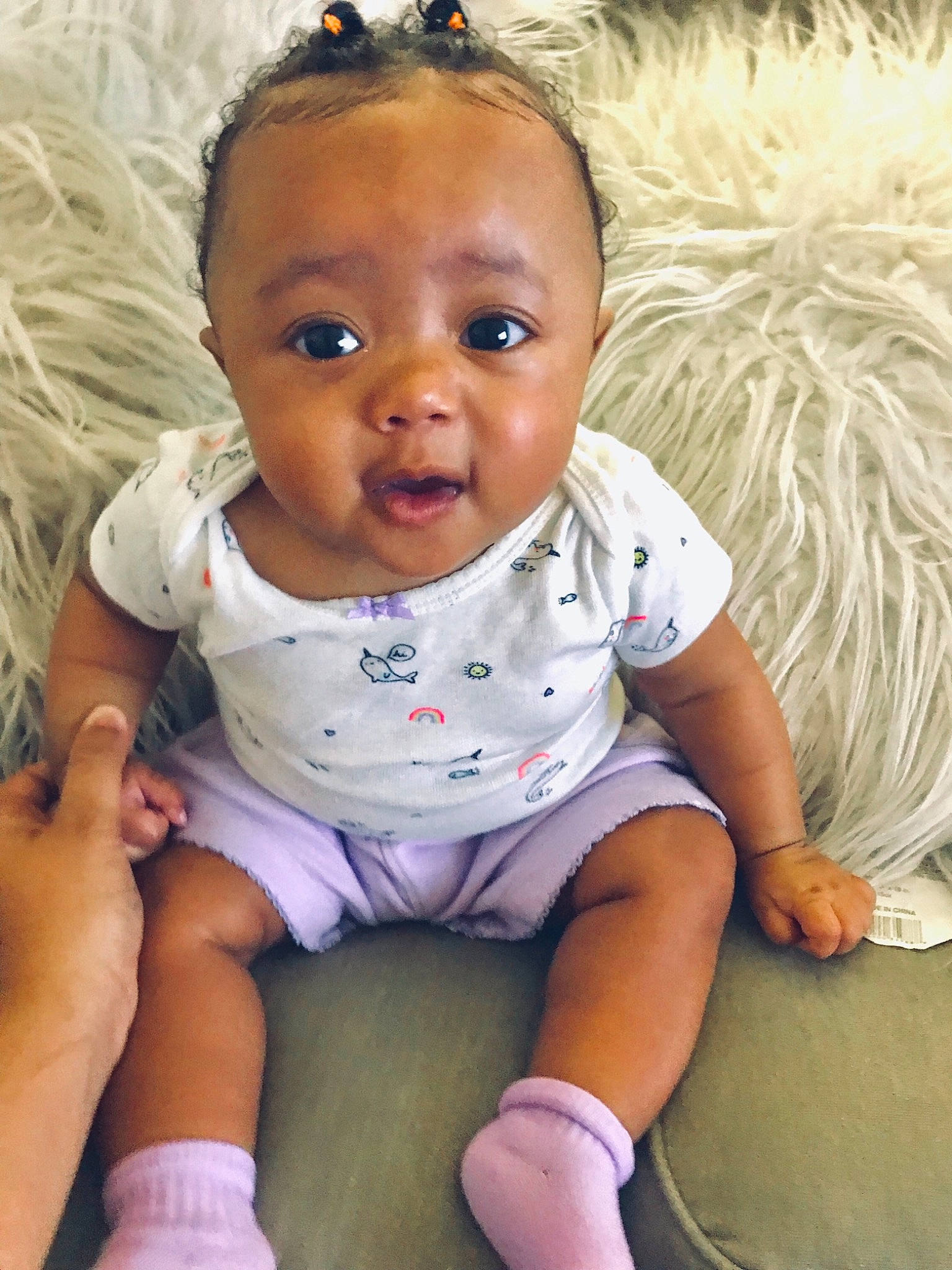 Nyomi joined the competition — help win amazing prizes! baby, baby_products, baby_toddler_clothing, black_hair, cheek, child, eye, forehead, head, iris, lip, nose, person, pink, product, sitting, skin, smile, toddler