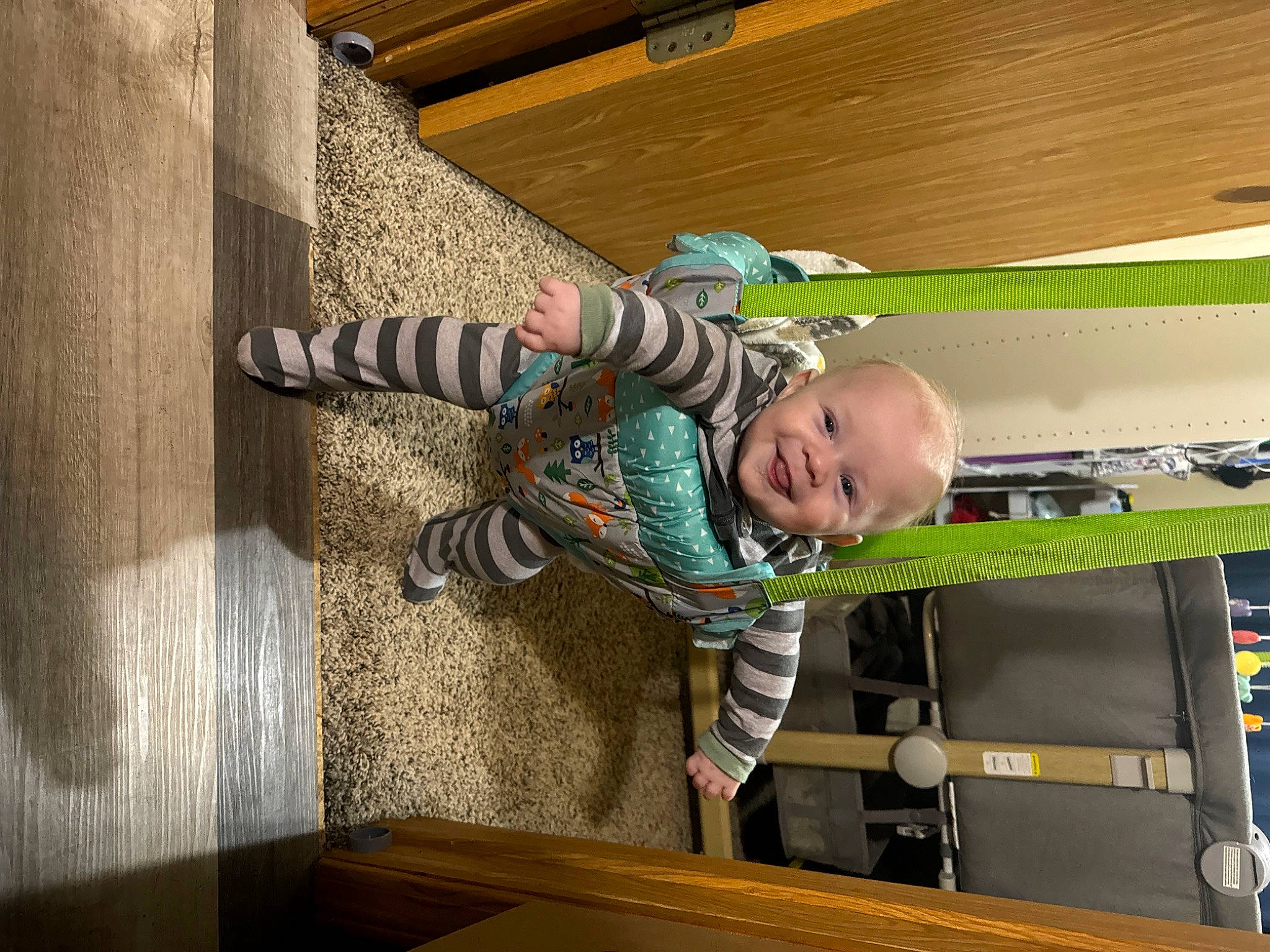 Bryson is registered to the contest to win money with this photo: baby, baby_products, baby_safety, baby_toddler_clothing, ceiling, child, comfort, flooring, hardwood, joy, pattern, person, play, room, shelf, toddler, wood, wood_flooring