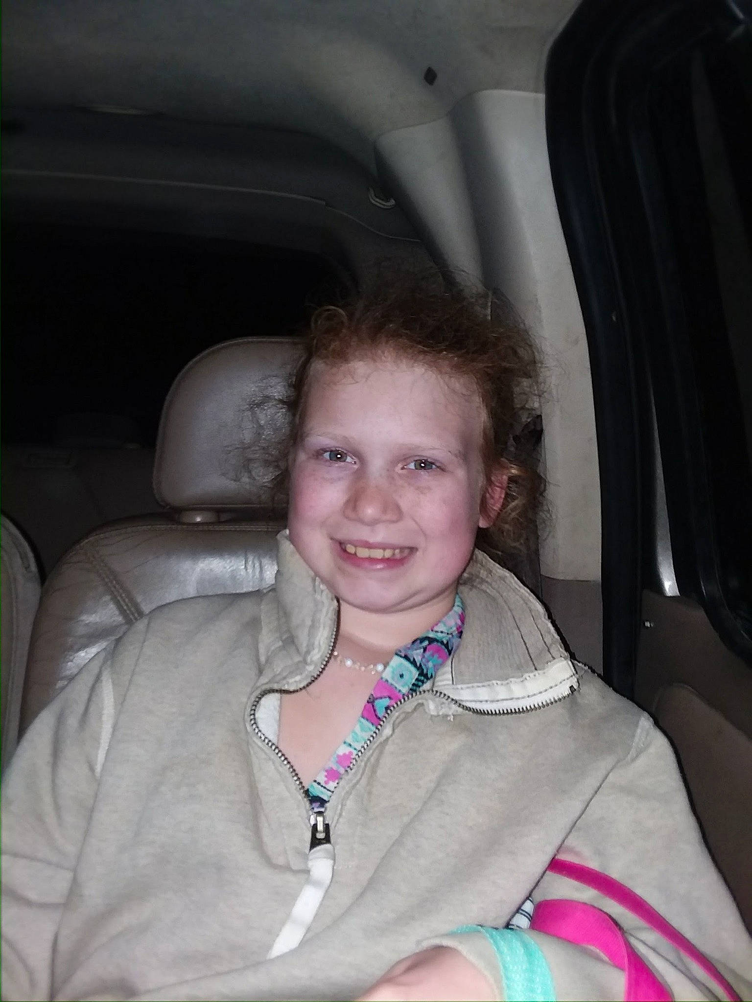 Chesney joined the competition — help win amazing prizes! car_seat, family_car, fun, joy, luxury_vehicle, person, sitting, smile, vacation