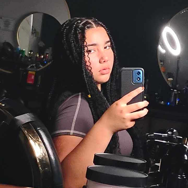 Zaria is registered to the contest to win money with this photo: adult, cosmetics, electronics, face, female, head, hockey, icehockey, icehockeypuck, indoors, lipstick, mobilephone, person, phone, photography, portrait, rink, skating, sport, woman