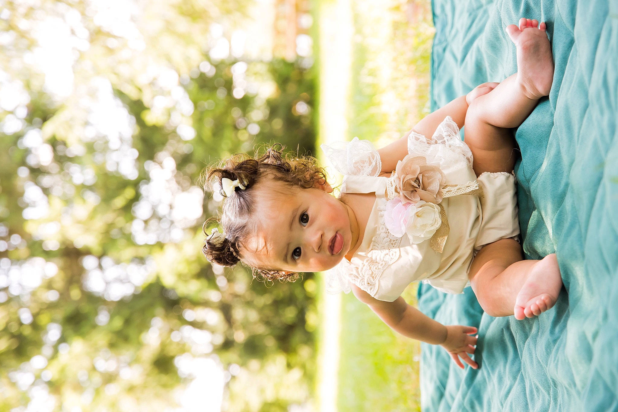 Melina joined the competition — help win amazing prizes! baby, bridal_clothing, child, dress, event, flash_photography, fun, gesture, grass, happy, leisure, people_in_nature, person, plant, play, portrait_photography, recreation, sitting, smile, toddler