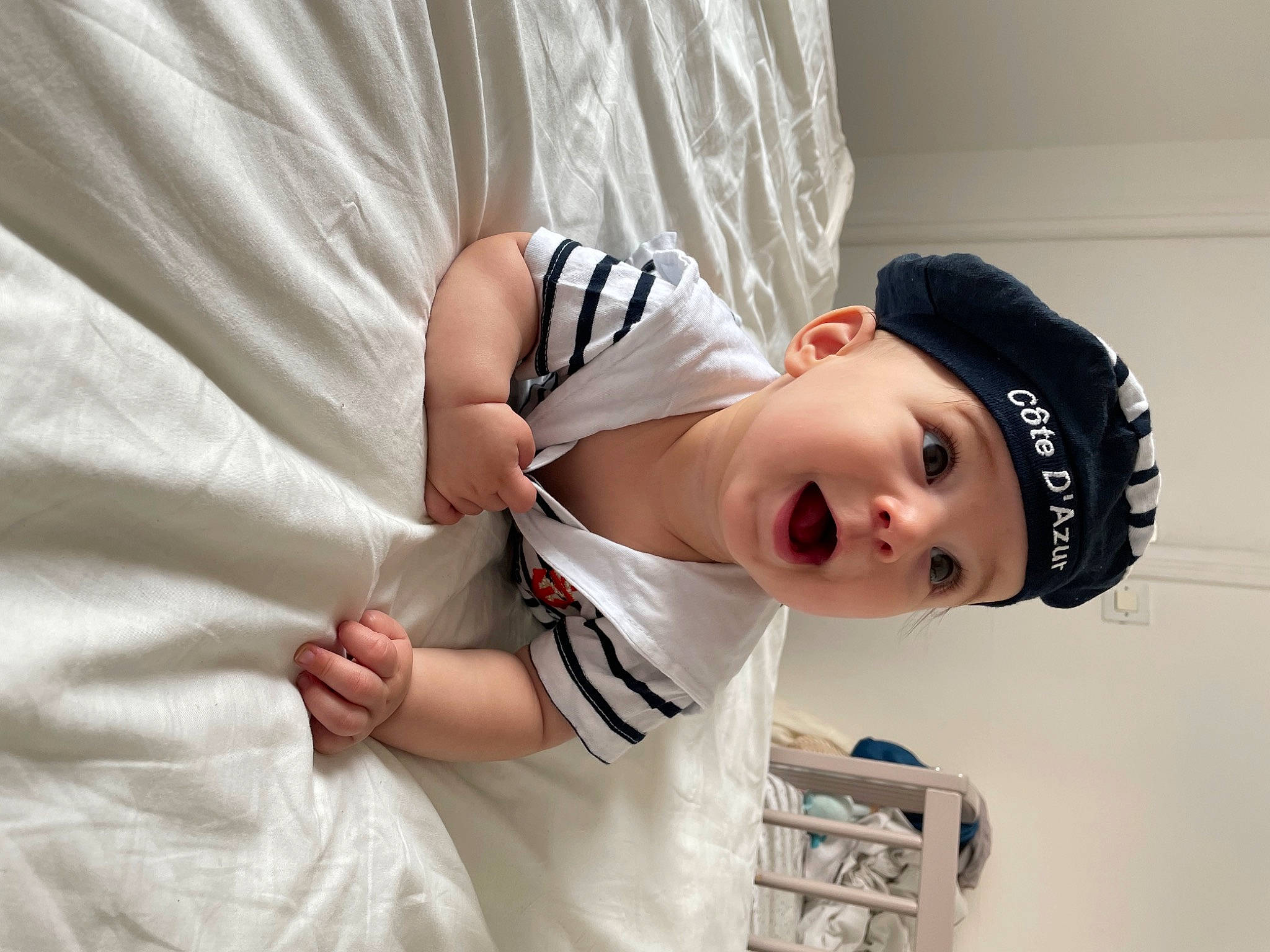 Liana participe au concours pour gagner de l'argent avec cette photo : arm, baby, baby_toddler_clothing, cap, child, comfort, elbow, eye, eyelash, flash_photography, happy, headwear, jewellery, linens, neck, person, shoulder, sleeve, smile, street_fashion