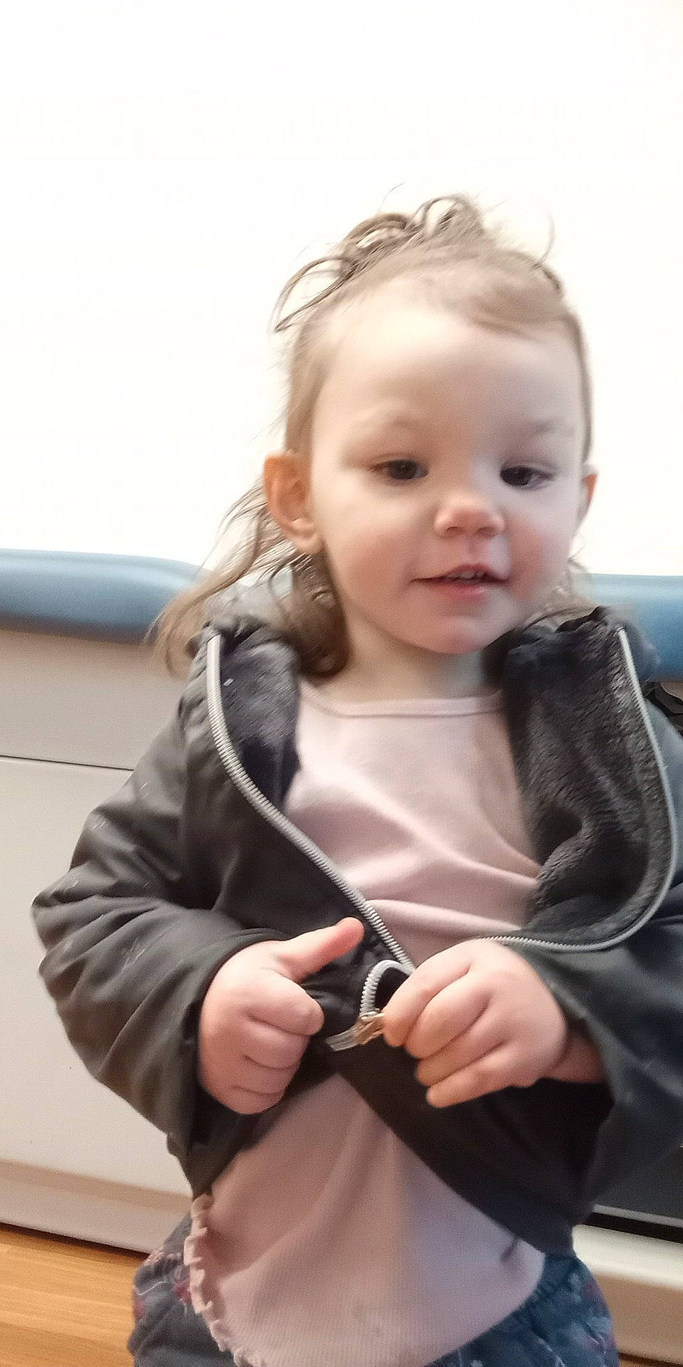 Peyton is registered to the contest to win money with this photo: baby, baby_toddler_clothing, blond, cheek, child, communication_device, eyelash, face, flash_photography, fun, gesture, happy, head, lip, mobile_phone, person, sitting, skin, sleeve, thumb