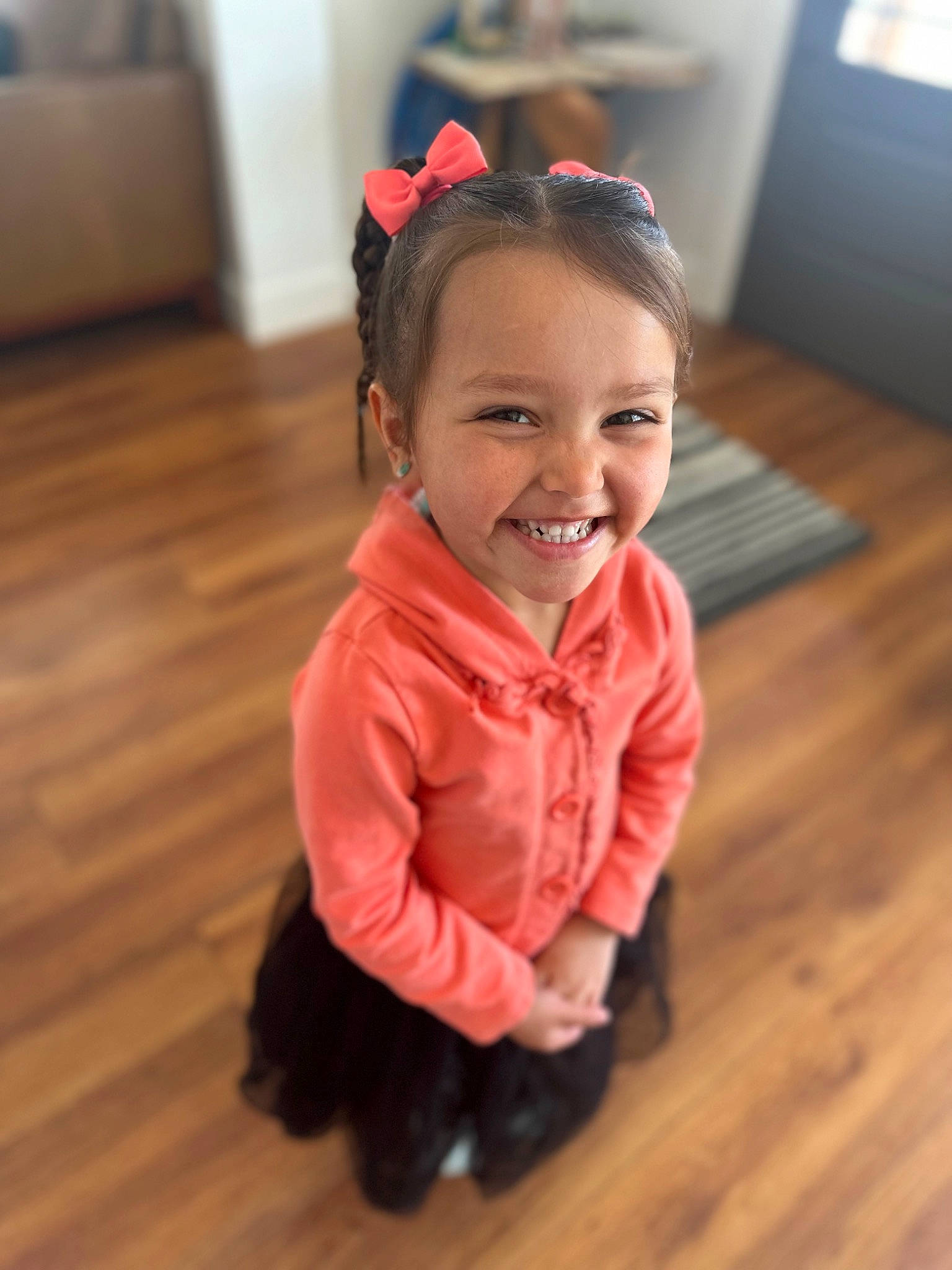 Wrigley is registered to the contest to win money with this photo: baby_toddler_clothing, eye, face, floor, flooring, hair, happy, hardwood, head, human_body, iris, joy, laminate_flooring, nose, person, skin, sleeve, smile, toddler, varnish