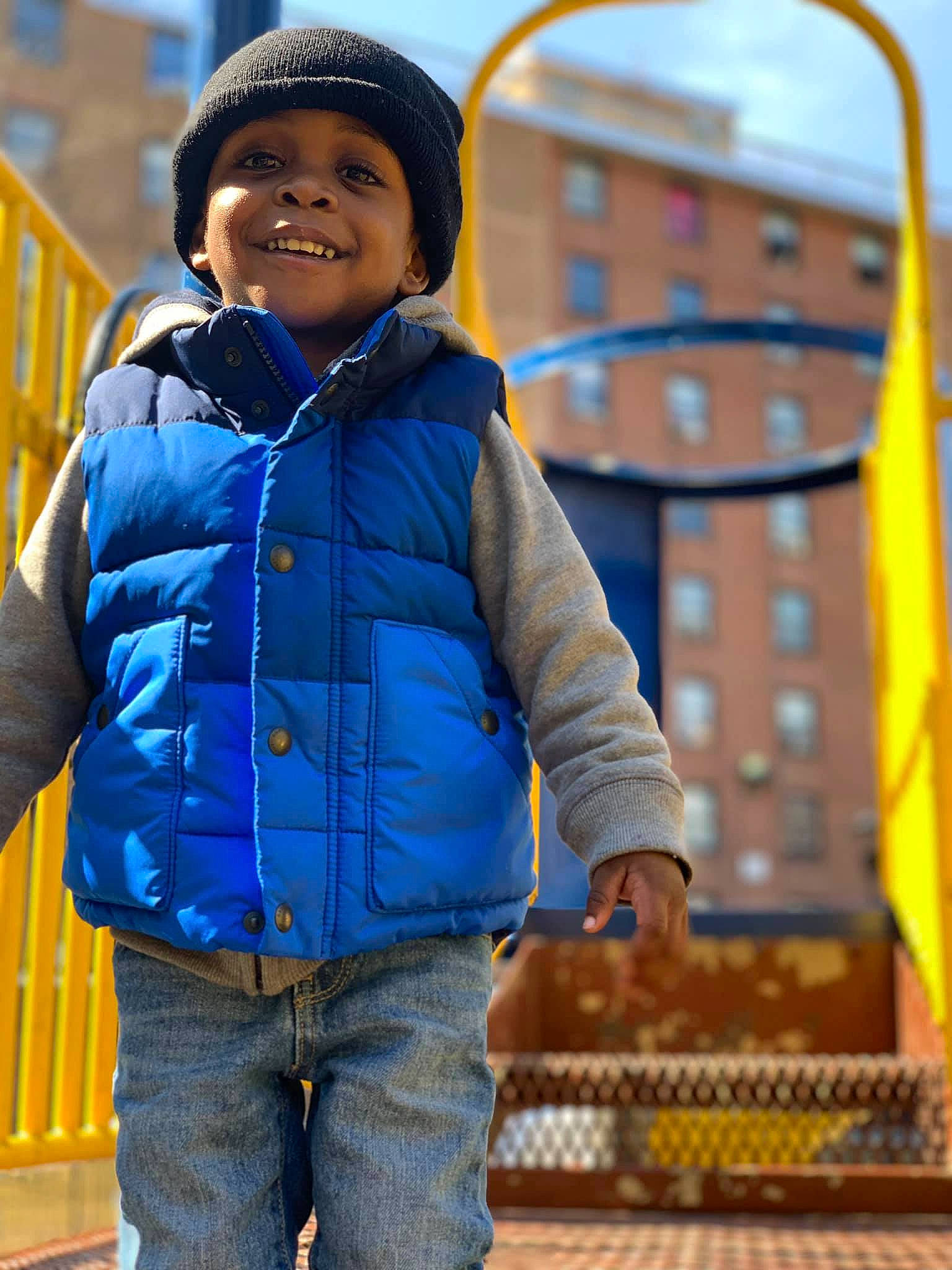 Kaeden is registered to the contest to win money with this photo: blue, child, denim, facial_expression, fun, jacket, jeans, joy, outerwear, people, person, smile, travel, yellow