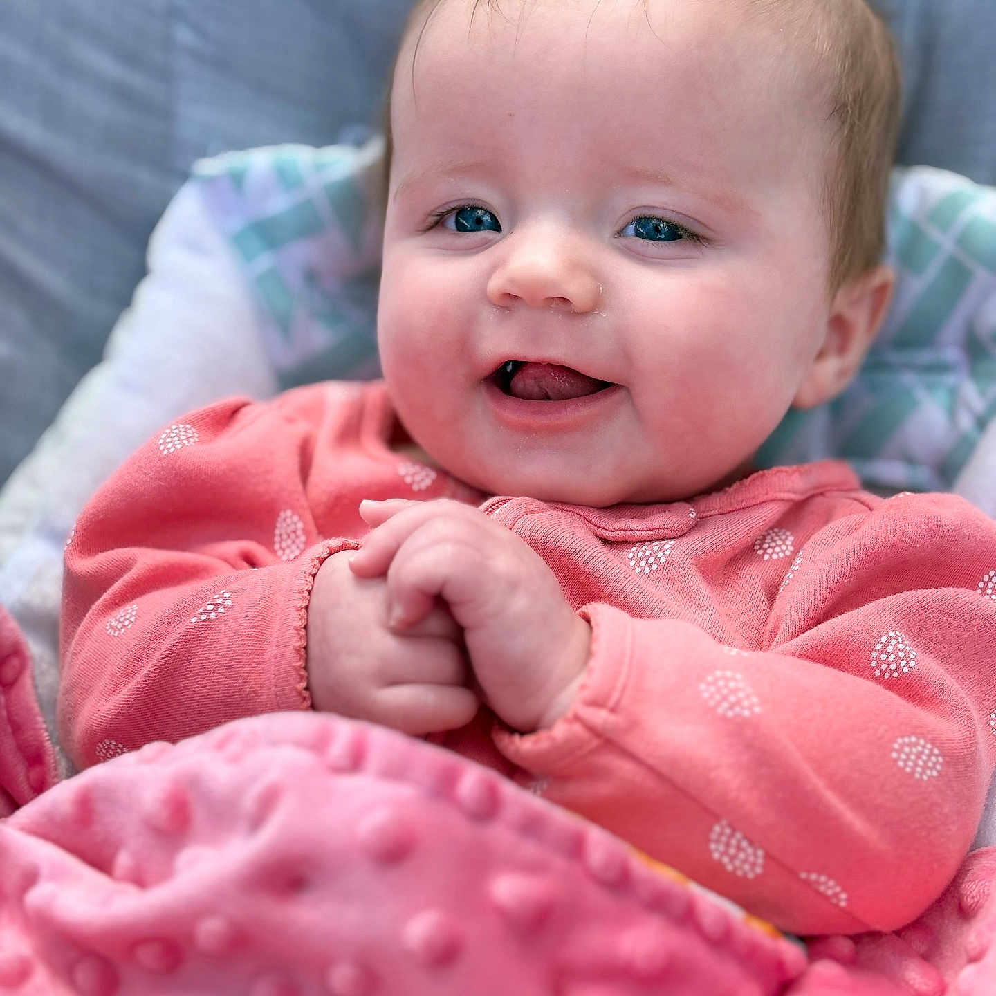 Rhylei joined the competition — help win amazing prizes! baby, babylaughing, blanket, bodypart, clothing, coat, cushion, face, finger, hand, happy, head, jacket, laughing, newborn, person, photography, portrait, quilt, smile