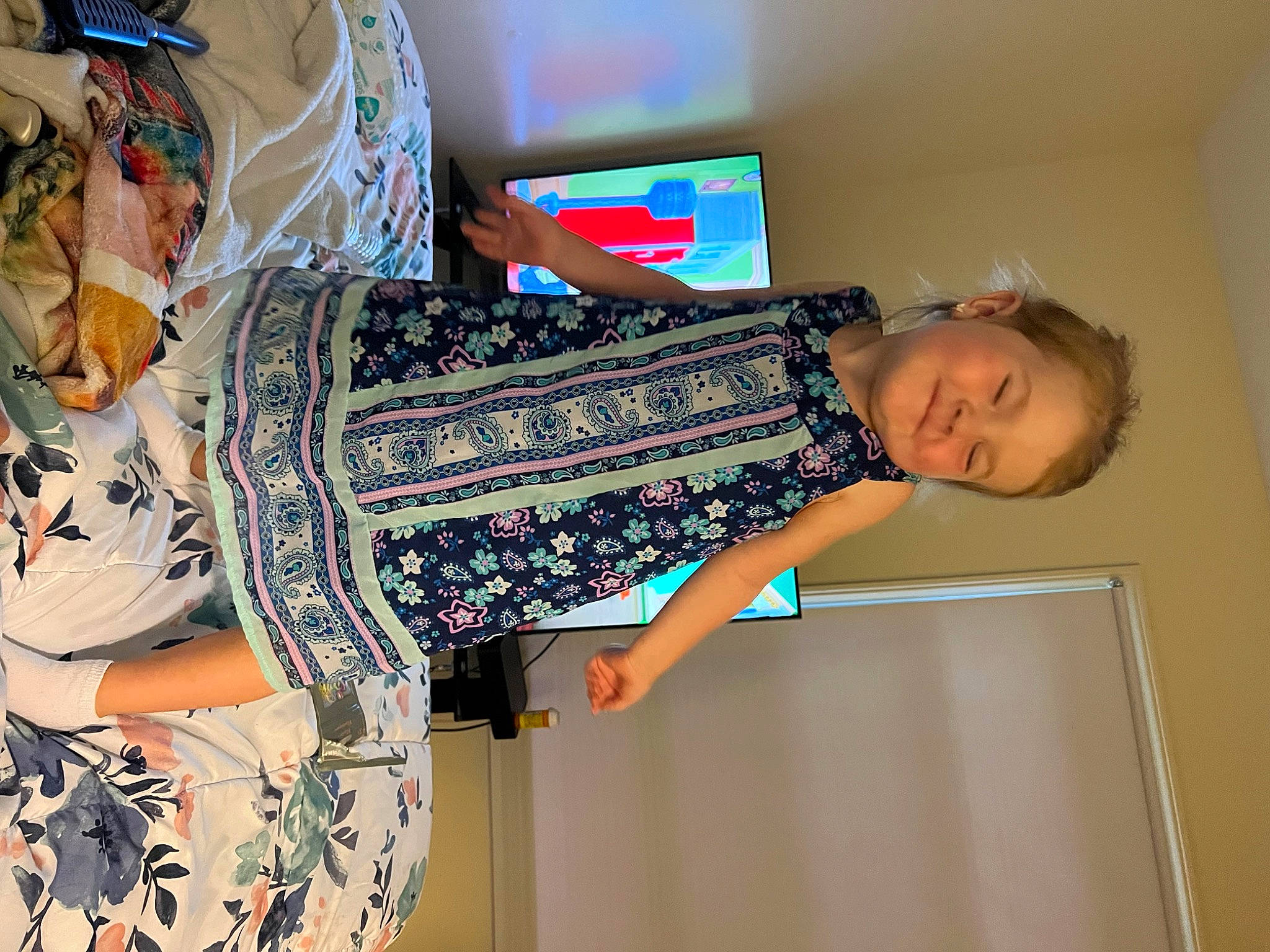 Ashlyn is registered to the contest to win money with this photo: elbow, electric_blue, fashion_design, fun, human_leg, joint, joy, knee, linens, magenta, pattern, person, room, sleeve, smile, sportswear, t_shirt, textile, thigh, visual_arts