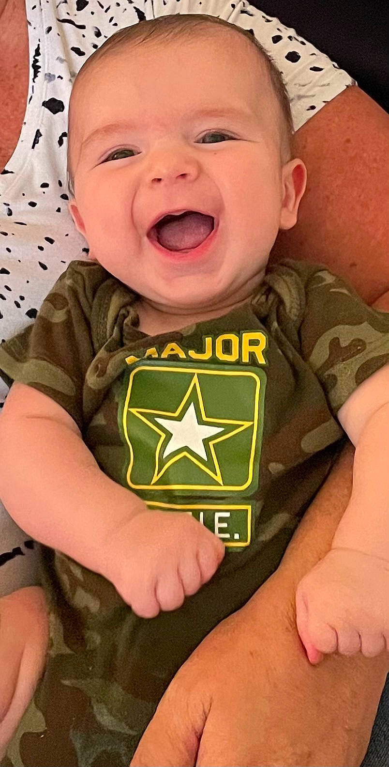 Judah is registered to the contest to win money with this photo: baby, baby_toddler_clothing, cheek, chin, eye, face, facial_expression, finger, happy, head, human_body, mouth, neck, nose, organ, person, skin, sleeve, smile, toddler