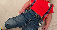Charles joined the competition — help win amazing prizes! baby, blanket, child, close_up, cozy, cute, denim_jeans, face, hand, home_interior, infant, leg, lying_down, name_board, portrait, red_shirt, smile, socks, suspenders, wooden_letters