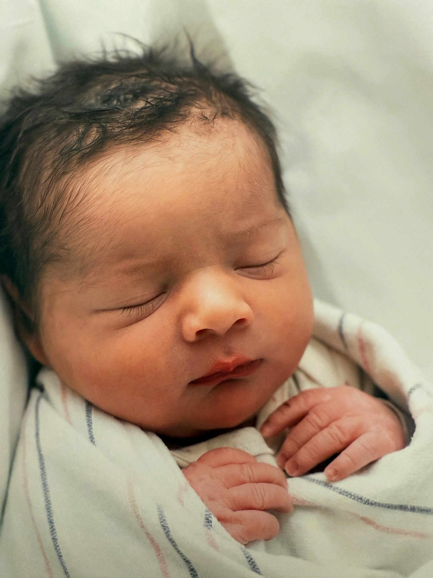 Keam is registered to the contest to win money with this photo: newborn, baby, sleeping, wrapped, blanket, hands, face, infant, soft, peaceful, cute, closeup, skin, human, portrait, resting, child, cozy, indoors, toddler
