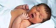 Keam is registered to the contest to win money with this photo: newborn, baby, infant, sleeping, yawning, blanket, skin, hand, fingers, face, peaceful, soft, cute, lying_down, indoors, closeup, head, resting, child, portrait
