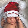 Keam is registered to the contest to win money with this photo: baby, sleeping, santa_hat, christmas, holiday, infant, blanket, cozy, cute, festive, red_hat, white_fur, newborn, soft_texture, child, resting, indoors, portrait, peaceful, holiday_season