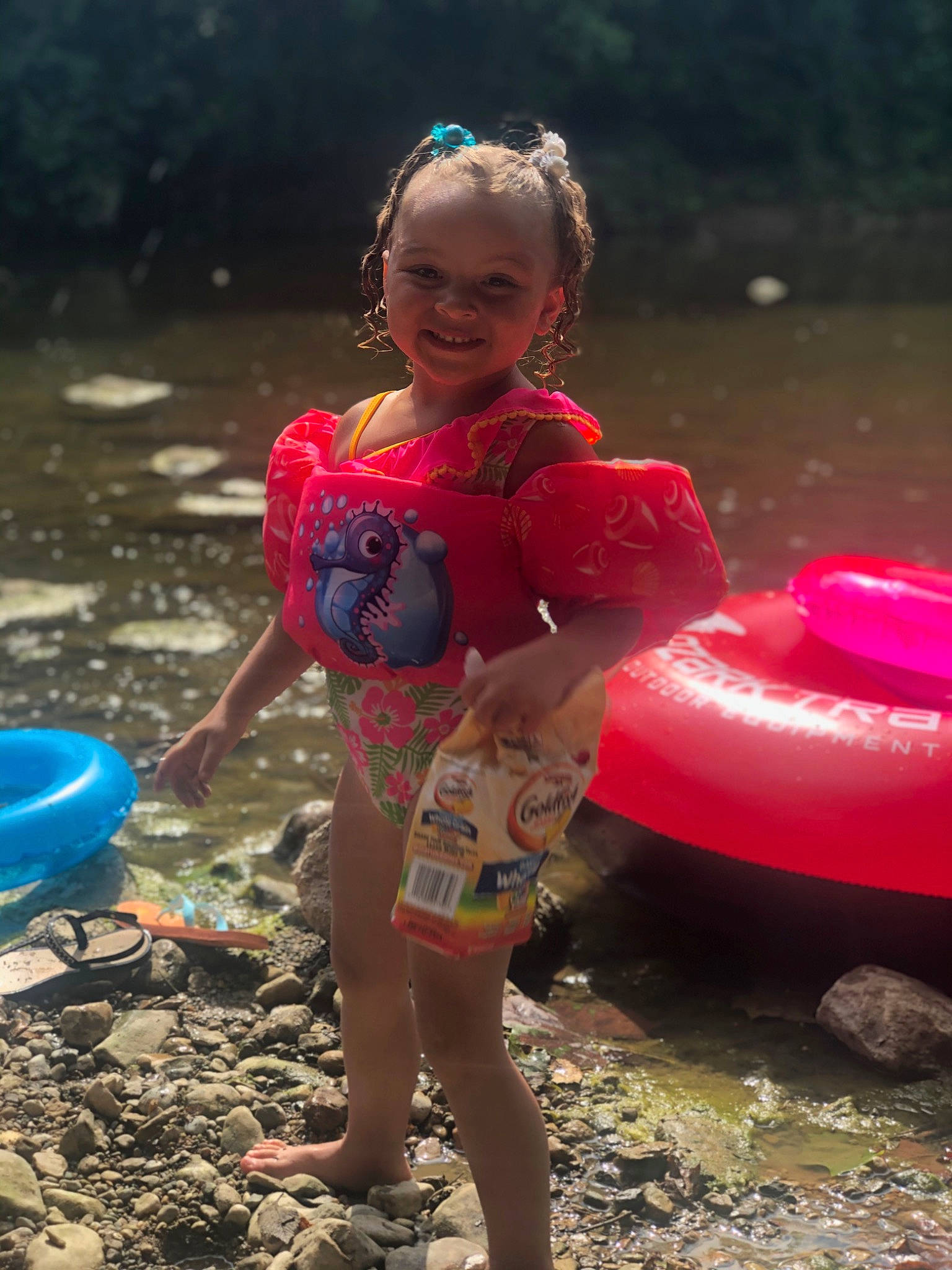 Addlynn is registered to the contest to win money with this photo: child, fun, joy, leisure, lifejacket, person, personal_protective_equipment, pink, play, recreation, smile, summer, toddler, vacation, vehicle, water
