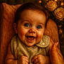 baby, child, smile, happy, blue_eyes, infant, hands, face, portrait, closeup, roses, flowers, blurred_background, warm_lighting, soft_texture, clothing, hand, candid, cute, joyful