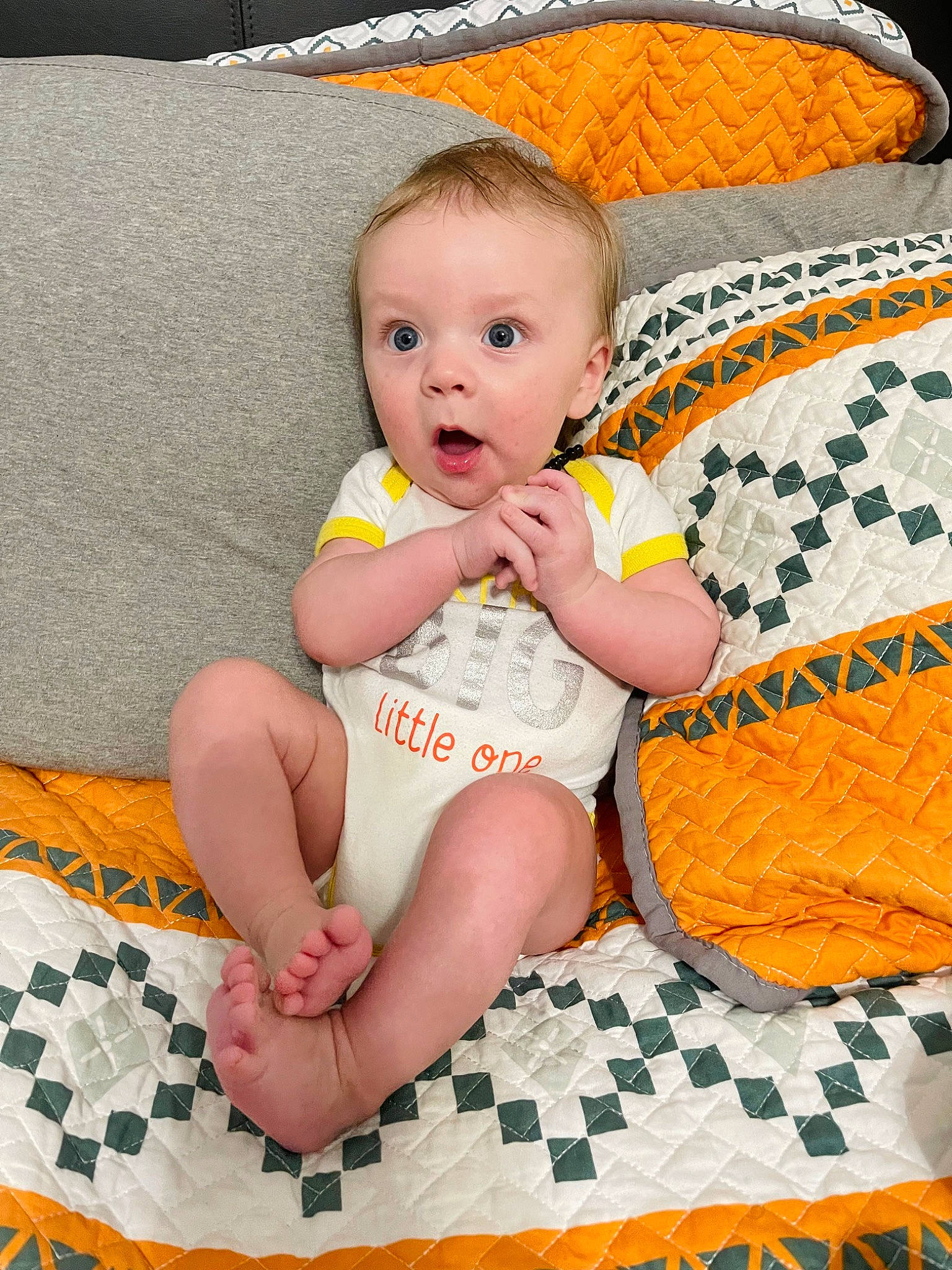 Maddox joined the competition — help win amazing prizes! baby, baby_toddler_clothing, barefoot, cheek, child, comfort, fashion_accessory, flooring, foot, happy, human_leg, pattern, person, room, sitting, skin, surprise, textile, thigh, toddler