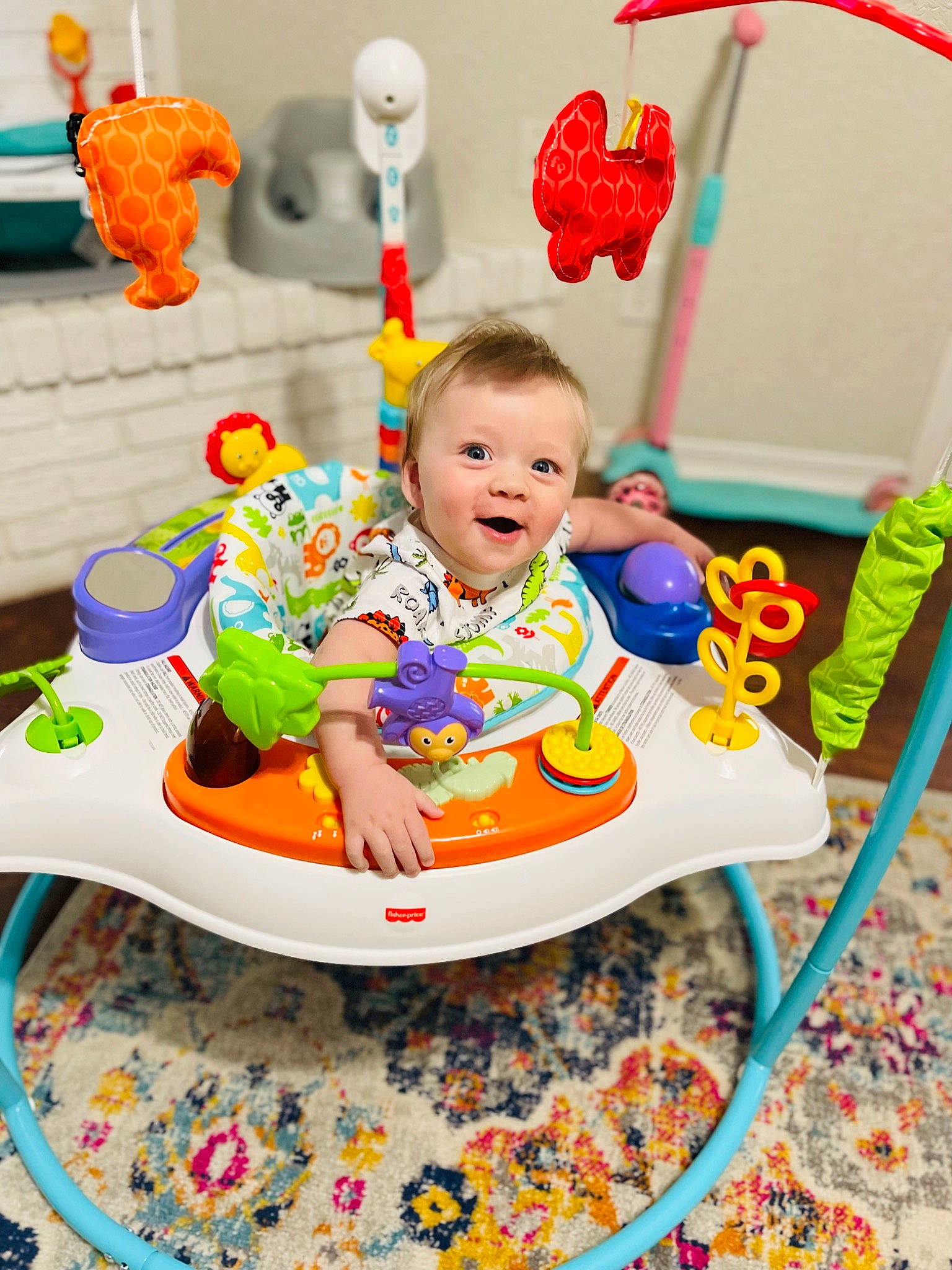 Maddox is registered to the contest to win money with this photo: baby, baby_mobile, baby_playing_with_toys, baby_products, baby_toddler_clothing, baby_toys, chair, child, event, face, fun, happy, leisure, person, play, room, sharing, sitting, smile, toddler