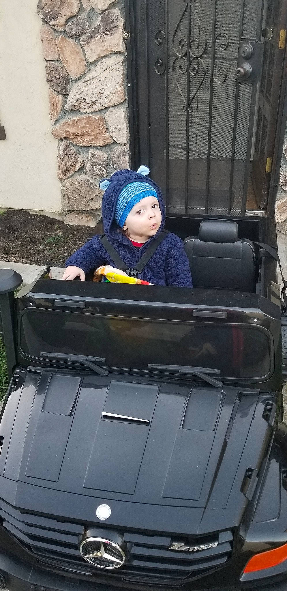 Caiden is registered to the contest to win money with this photo: auto_part, automotive_exterior, baggage, car, headwear, motor_vehicle, person, vehicle