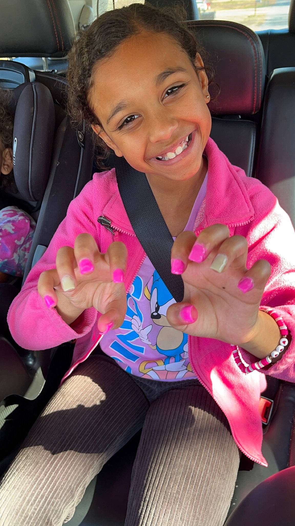 Addison is registered to the contest to win money with this photo: cheek, child, cool, eye, face, facial_expression, finger, gesture, hair, hand, happy, head, joy, lip, mouth, nail, person, pink, skin, smile