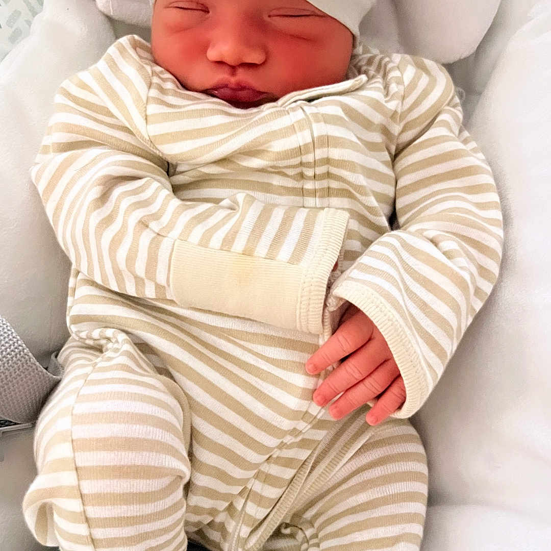 Maia Luna joined the competition — help win amazing prizes! baby, bed, blanket, clothing, cushion, face, furniture, glove, happy, hat, head, homedecor, newborn, pajamas, person, photography, portrait, quilt, sleeping, smile