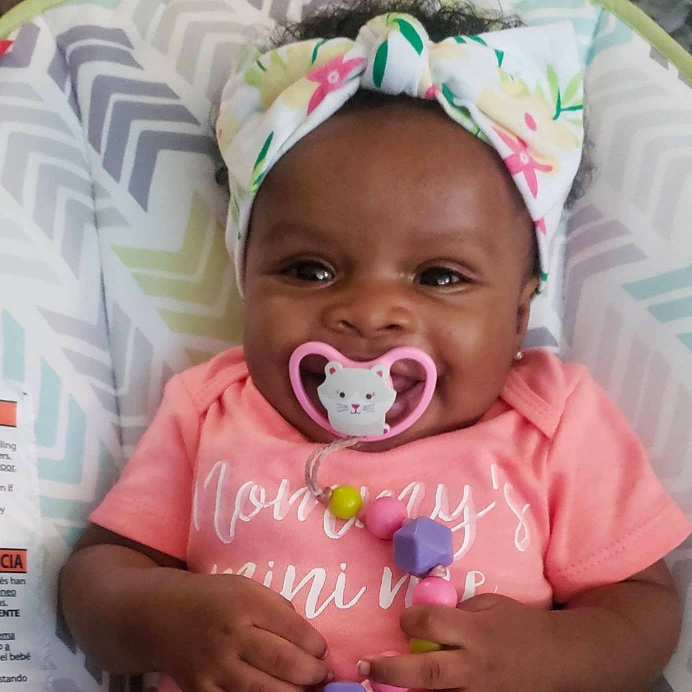 Ariyana is registered to the contest to win money with this photo: baby, baby_toddler_clothing, cheek, child, hair_accessory, head, headgear, mouth, person, pink, toddler