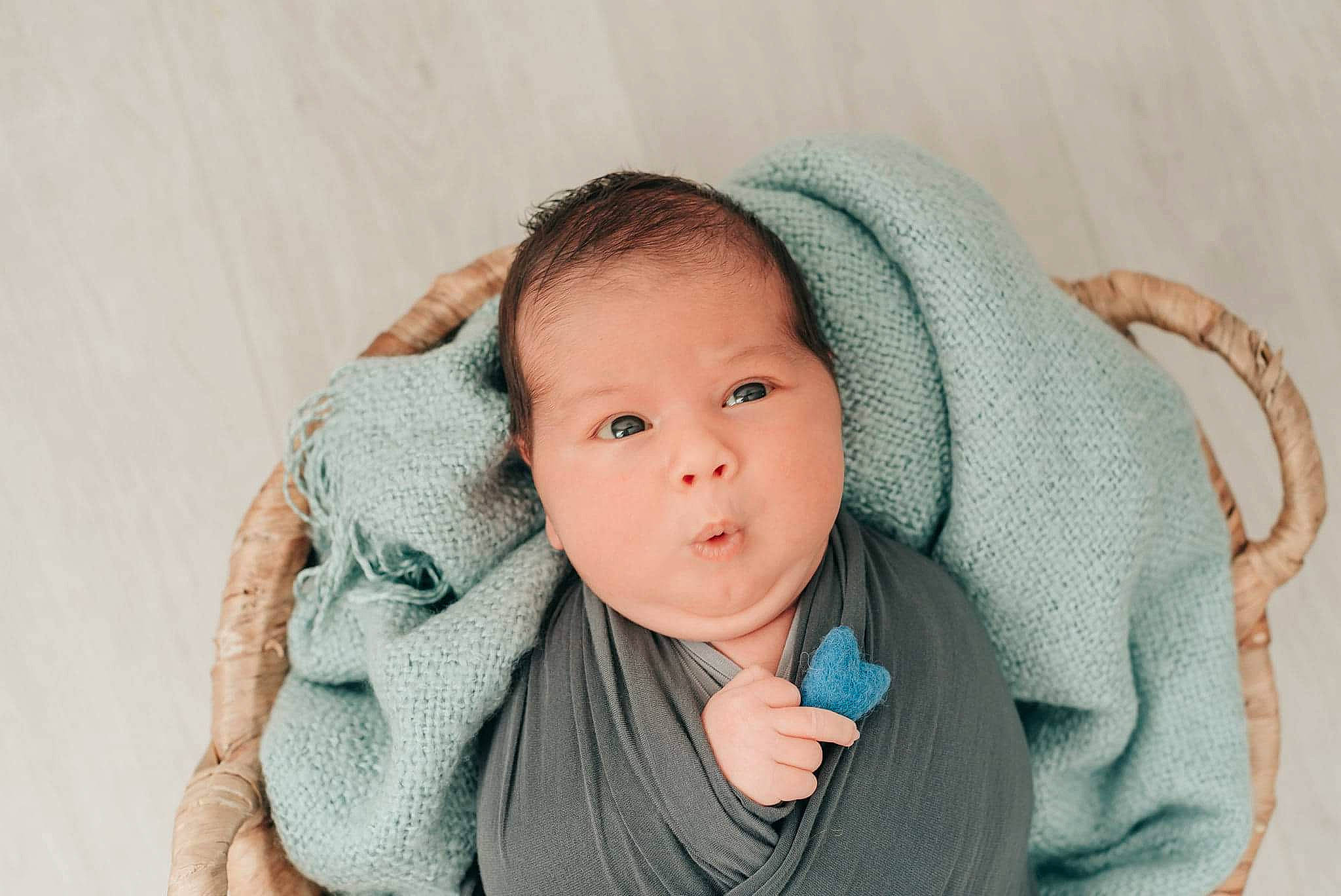 Barlas is registered to the contest to win money with this photo: baby, cheek, child, ear, eye, green, head, linens, outerwear, person, photography, portrait_photography, skin, textile, toddler, turquoise