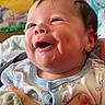 Briere joined the competition — help win amazing prizes! baby, smiling, infant, face, hand, clothing, onesie, cheeks, happy, portrait, closeup, person, skin, head, expression, cute, newborn, holding, indoors, child
