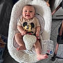 Ange a rejoint le concours — aidez-le/la à gagner de superbes lots ! baby, infant, smile, mickey_mouse, tshirt, baby_rocker, seat, floor, tile_floor, furniture_leg, bracelet, indoor, happy, child, person, foot, hand, head, face, cozy
